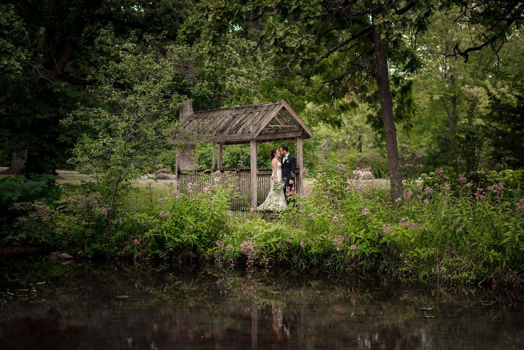 Couple gets married outside surrounded by trees at The shores of Turtle Creek