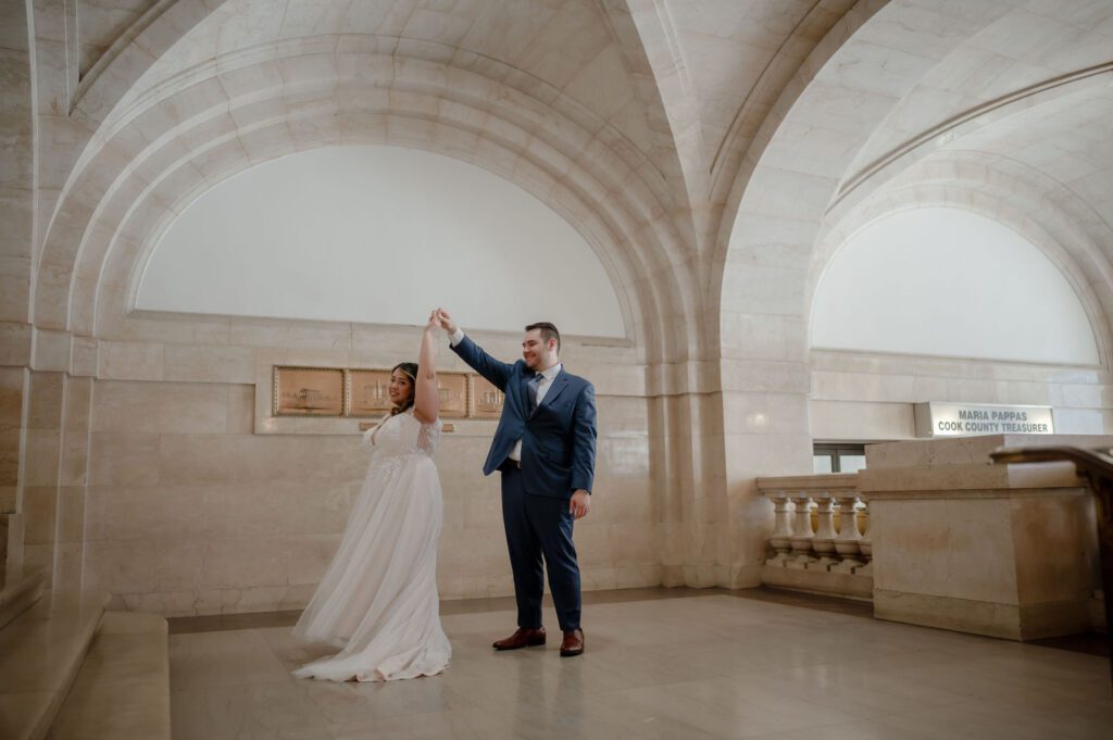 A couple dance inside the Chicago City Hall after getting married