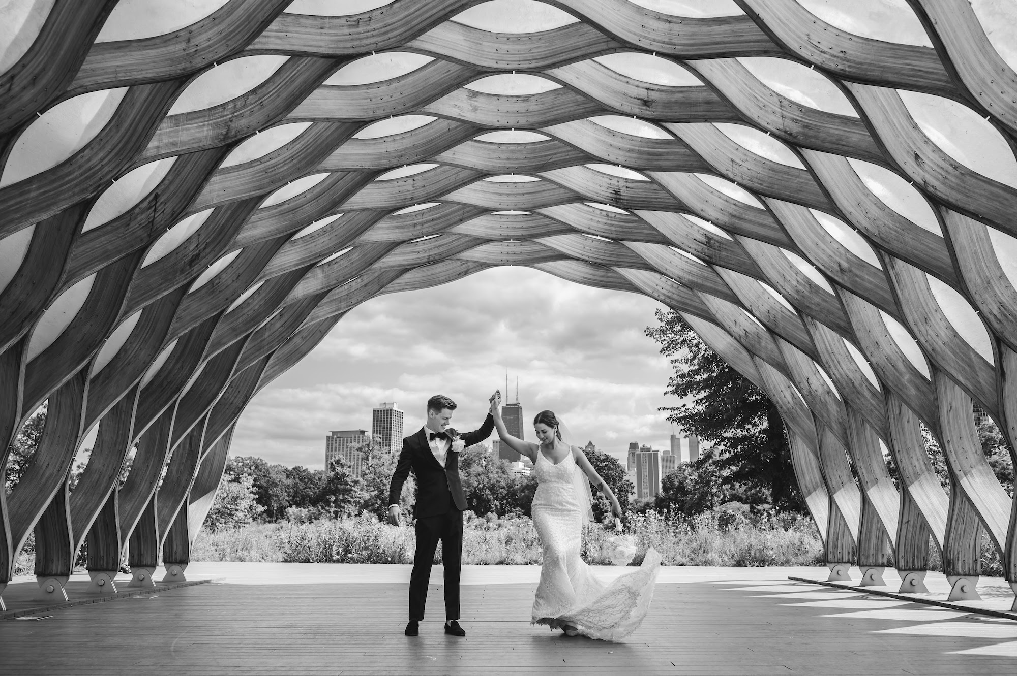 Bride and groom dance underneath the Honeycomb in Lincoln Park