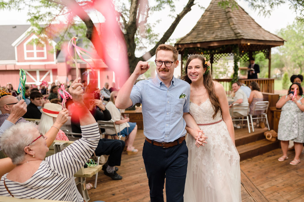 Bride and groom celebrate after gatting married at Buffalo Creek Brewing in Buffalo Grove.