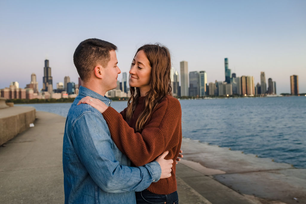 A couple walk on the lakefront path at the Adler Planetarium at Sunrise