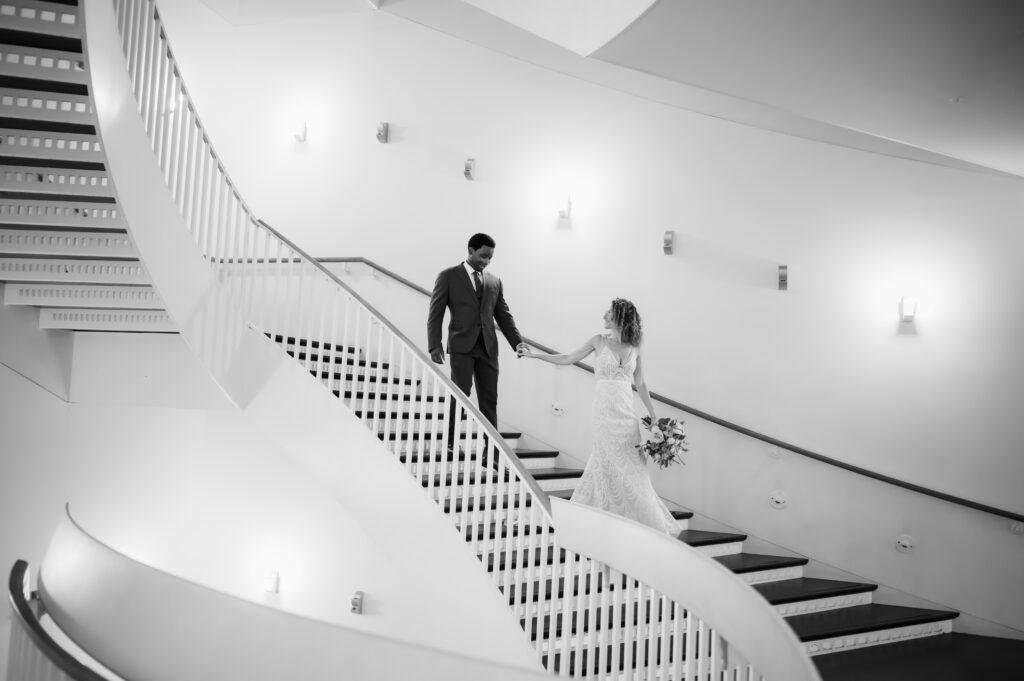 A couple walk down the unique steps at the Museum of Contemporary Art.