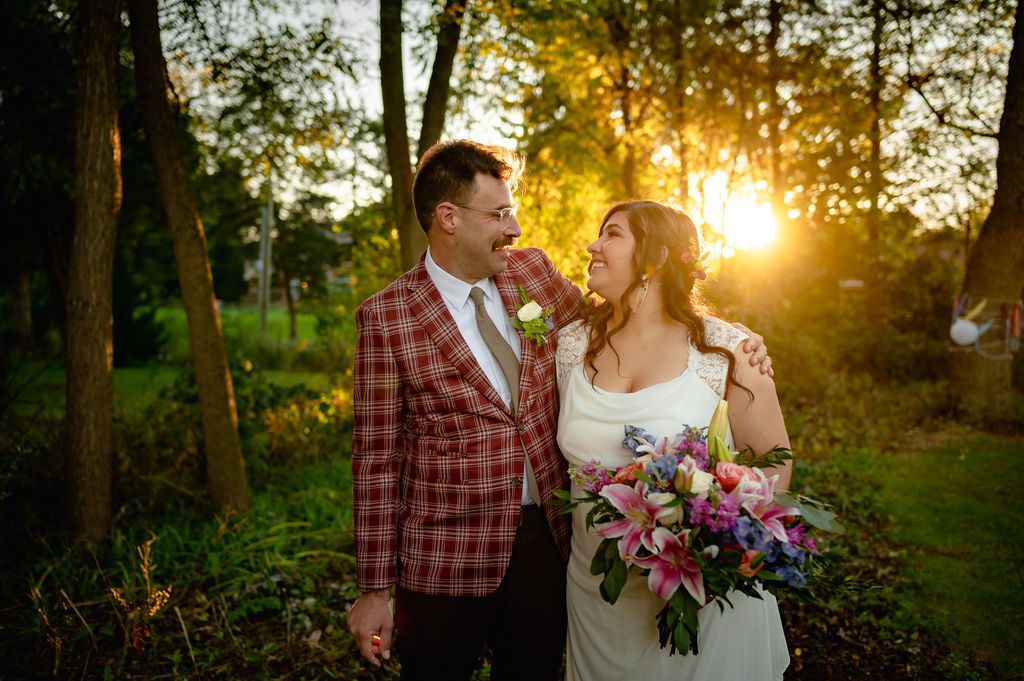 Bride and groom at sunset during their intimate backyard wedding