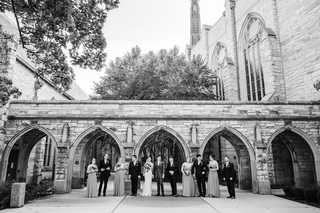 Wedding party walk outside of Alice Millar Chapel