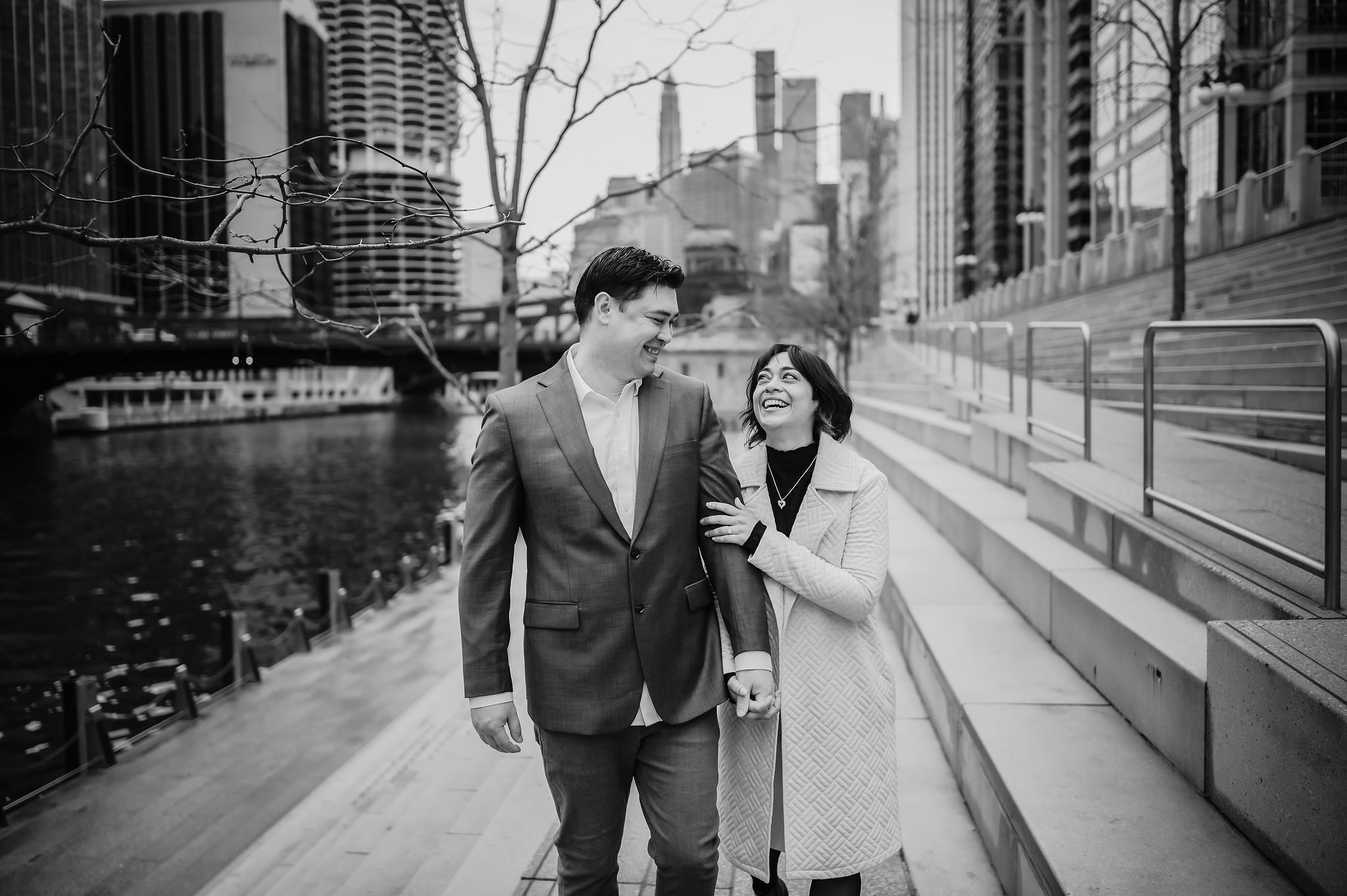 A man and women embrace on the Chicago Riverwalk.