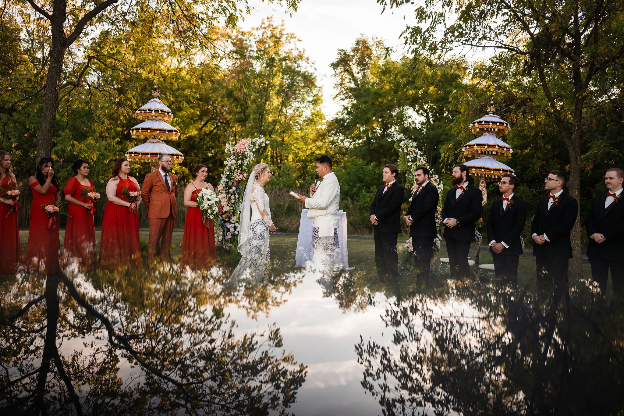 A couple get married outside surrounded by trees at Lakes at Lacey.