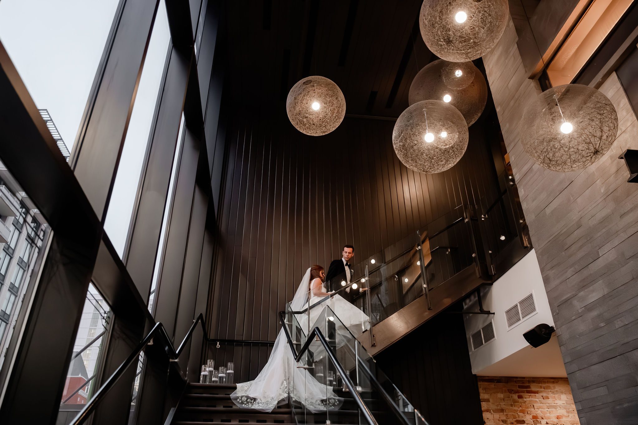 Bride and groom walk up stairs at the Chicago Winery.